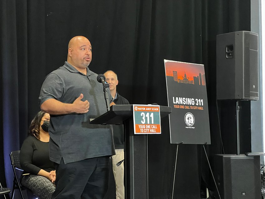 311 Manager Augustine “Auggie” Martinez speaks at a press conference.